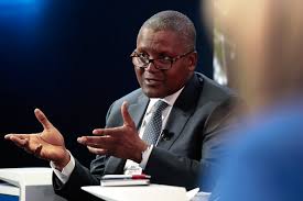 An African make, sixties, speaking at at event