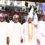 Tinubu Recalls ‘Emi Lo’kan’ Campaign, Declares Economic Suffering Over Men posing for a picture in African Attire