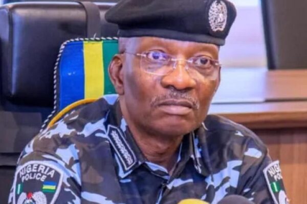 Aged man dressed in Police uniform wearing a pair of spectacles