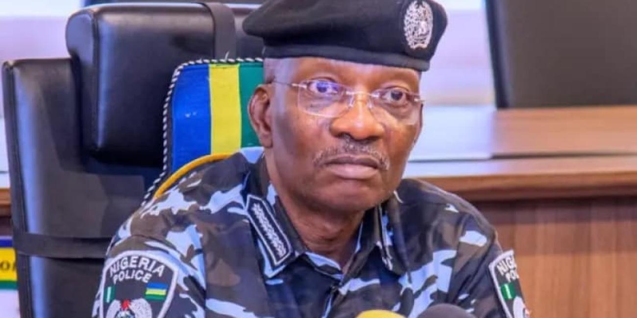 Aged man dressed in Police uniform wearing a pair of spectacles
