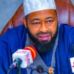 Male sitting during a press conference