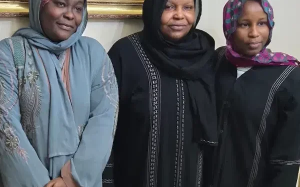 Three middle aged women posing for mug shots