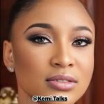 female with a lot of makeup on her face