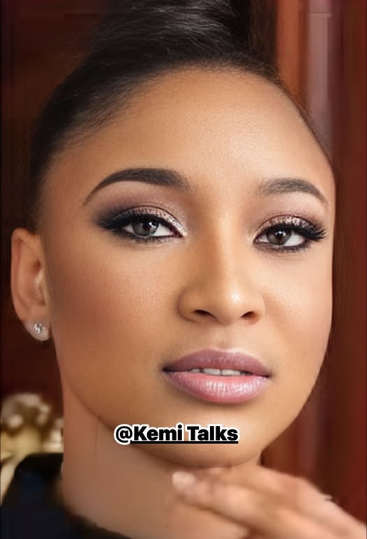 female with a lot of makeup on her face
