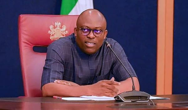 a male in a state house seated
