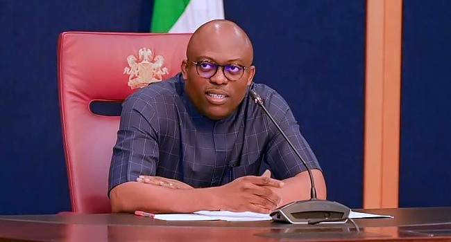 a male in a state house seated