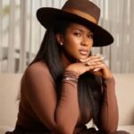 Beautiful African lady dressed with a hat on