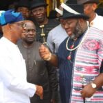 Wike and Asari in a standup meeting