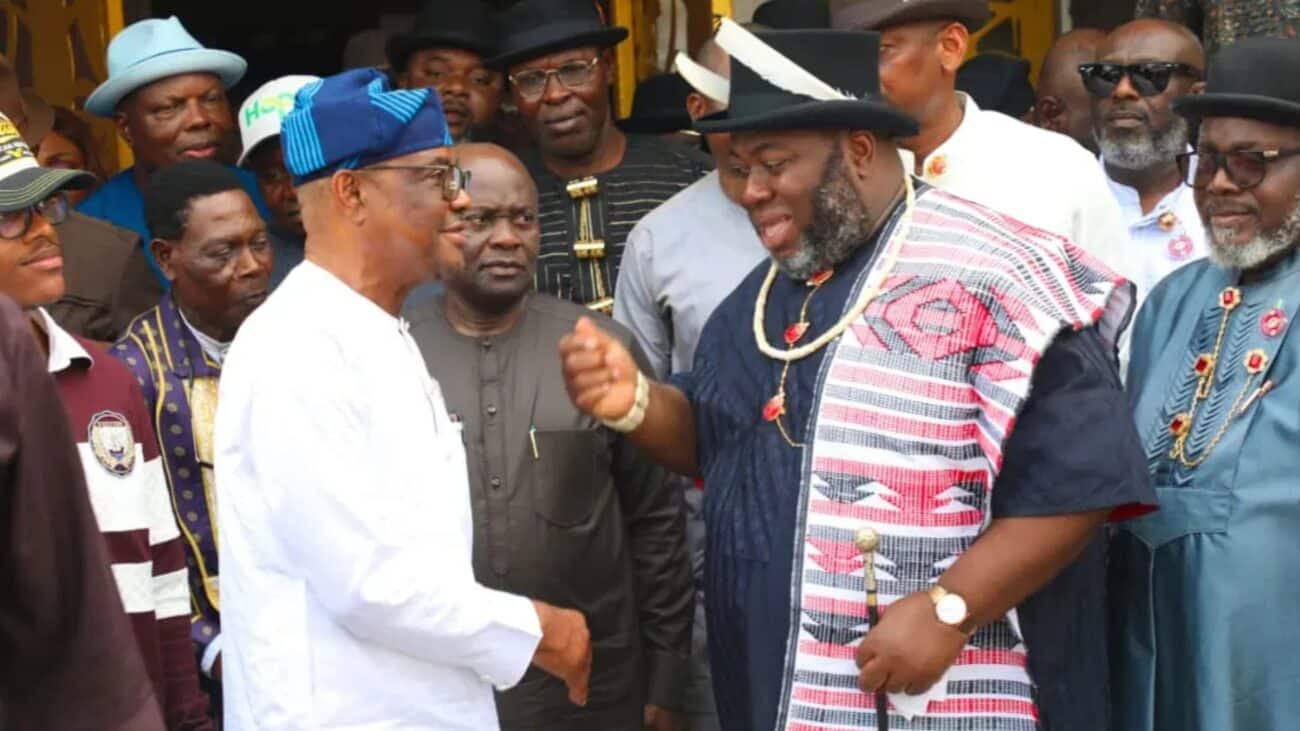 Wike and Asari in a standup meeting