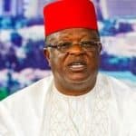 male with a red cap holding the office of Nigerian minister for Works
