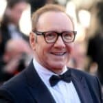 Hollywood actor in a suit and spectacles