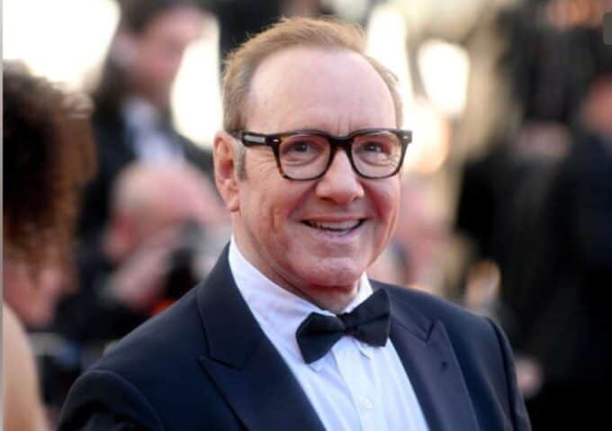 Hollywood actor in a suit and spectacles